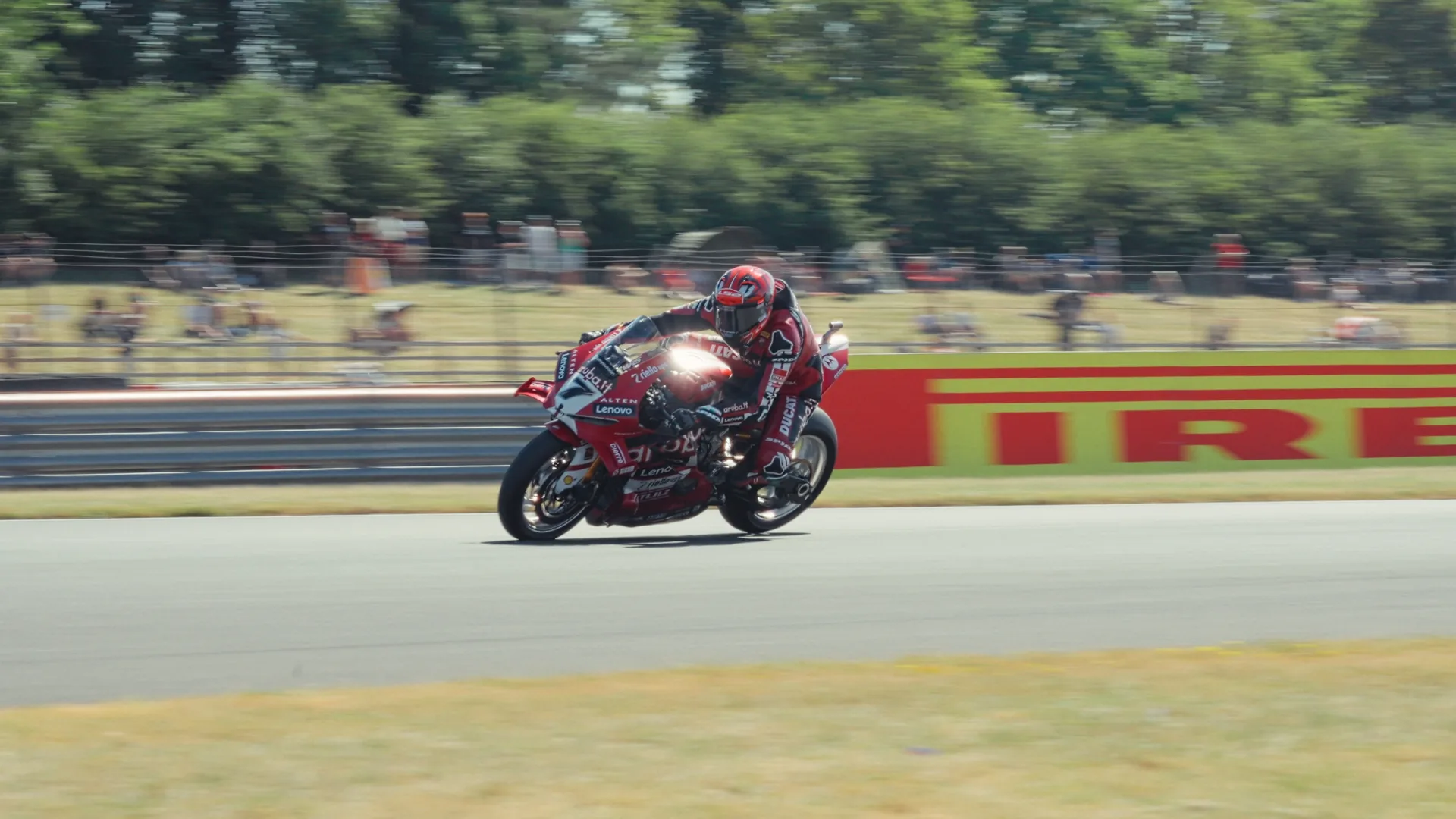 Motorcycle racer accelerating on circuit, captured by Ben